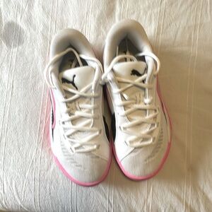 Pink, White, and black Puma basketball shoes. Size 4 in kids.